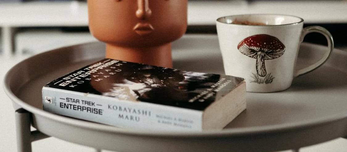 Kobayashi Maru, image source: https://www.pexels.com/photo/a-coffee-cup-and-a-book-on-a-coffee-table-28379134/